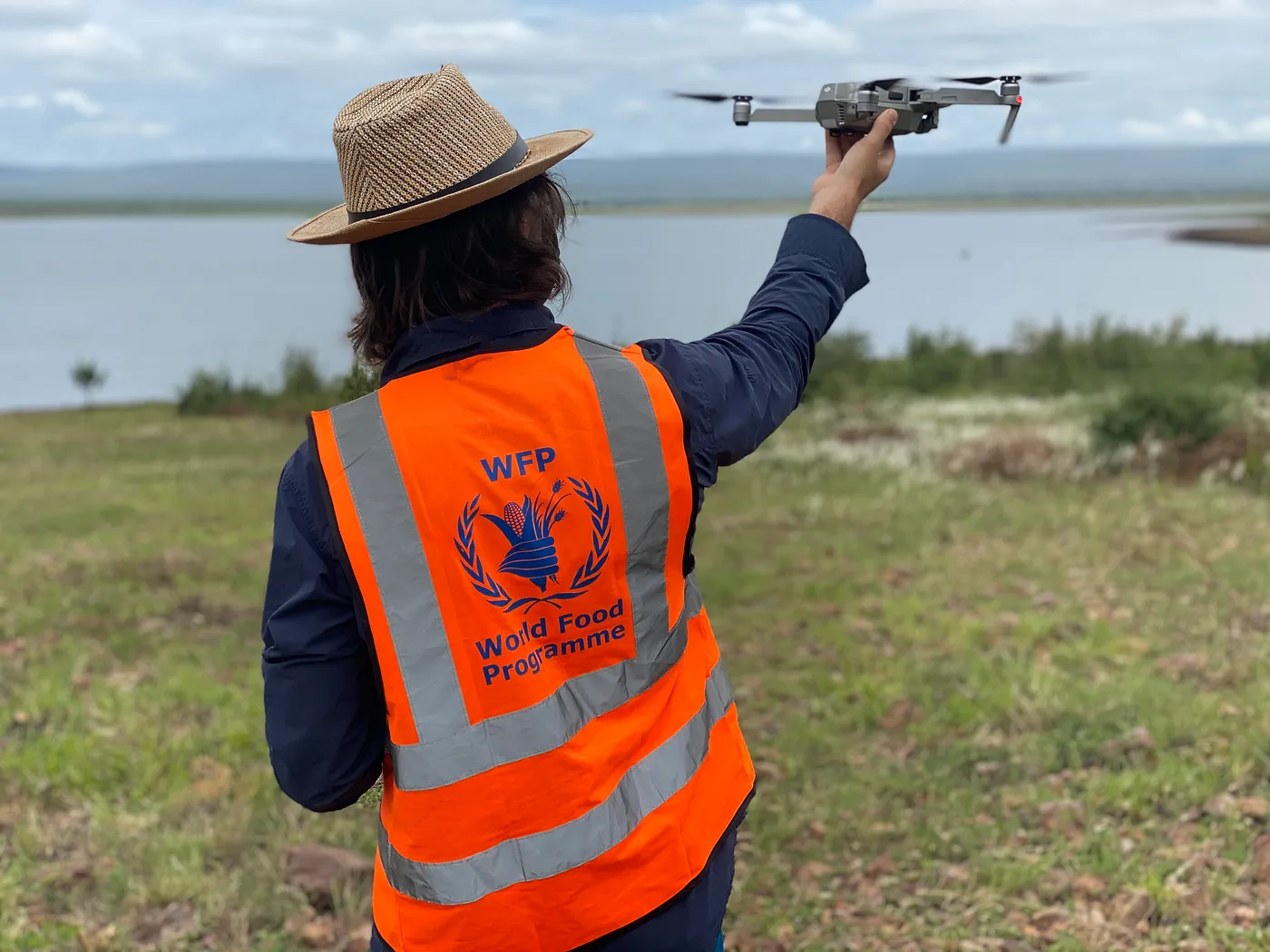 Patrick McKay, UAS Data Operations Manager at the World Food Programme (WFP), launches a drone.